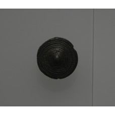 A bronze disc series of arrows forming circles forming the s